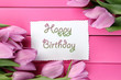 Photo: Beautiful bouquet of purple tulips and card Beautiful bouquet of purple tulips and card
