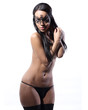 sexy half naked woman with a venetian mask on her face