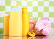Baby cosmetics and towel in bathroom