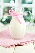 Pitcher of milk on table in room