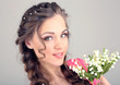 Young woman with beautiful hairstyle and flowers,