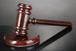 Wooden gavel on grey background