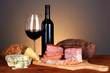 Exquisite still life of wine, cheese and meat products