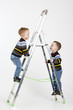 Foto: Twin brothers on stairs Twin brothers on stairs