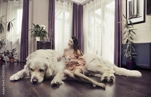 Photo: Young woman hugging big dog Young woman hugging big dog