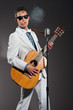 Retro rock and roll singer wearing white suit and black sunglass