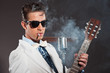 Retro rock and roll singer wearing white suit and black sunglass