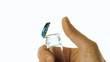 Hand popping open glass bottle