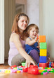 Photo: pregnant mother plays with child pregnant mother plays with child