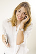 smiling girl using phone and holding tablet