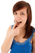 Foto: Die junge Frau isst mit Genuss eine Praline Die junge Frau isst mit Genuss eine Praline