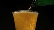 Bottle pouring beer into glass