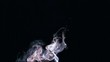 White smoke rising up on black background