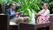 Young happy couple with tablet computer in garden