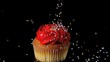 Sprinkles falling onto red iced cupcake