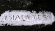 Diabetes spelled out in sugar blowing away