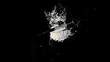 Needle falling on pile of white drug