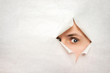 Man watches through a hole