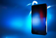 Black smart phone on blue defocus background, concept, template