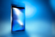 Black smart phone on blue defocus background, concept, template