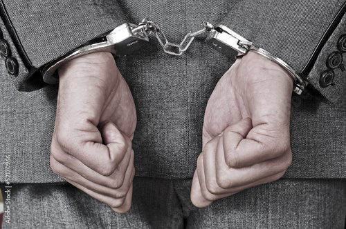 Photo: handcuffed man handcuffed man