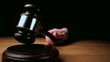 Judge hitting mallet off sounding block