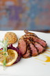 Duck breast fillet with red cabbage and potato ball.