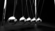 Perpetual motion of newtons cradle close up