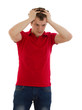 The man is surprised and grabs his head