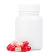 Red pills and pill bottle