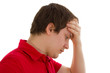 The man is surprised and grabs his head
