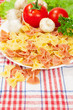 Vegetarian food. farfalle with fresh tomatoes
