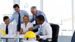 Group of architects looking at plans