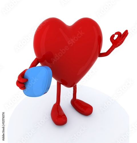 Illustration: heart with big blue pill on hand heart with big blue pill on hand