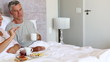 Mature couple having a breakfast in the bed