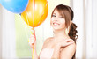 happy teenage girl with balloons