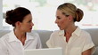 Businesswomen working together on a laptop