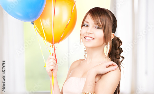 Photo: happy teenage girl with balloons happy teenage girl with balloons