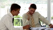 Businessmen going over the plans