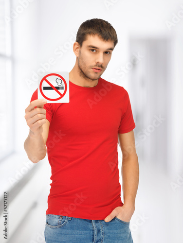 Photo: man in red shirt with no smoking sign man in red shirt with no smoking sign