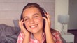 Girl listening to music with headphones