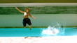 Siblings jumping together in the swimming pool