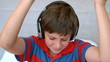 Young boy enjoying music with headphones