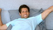 Video: Tanned man waking up and stretching Tanned man waking up and stretching