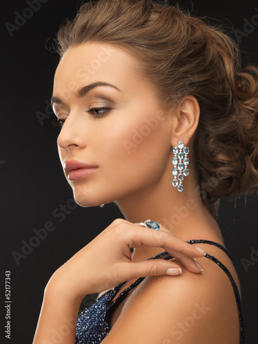 Photo: woman with earrings and ring woman with earrings and ring