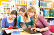 Photo: Students in library are a learning group Students in library are a learning group