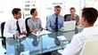 Business team giving a job interview to a businessman