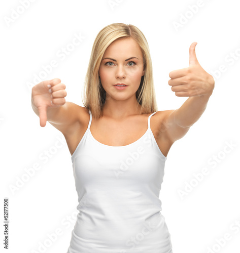 Photo: woman with thumbs up and down woman with thumbs up and down