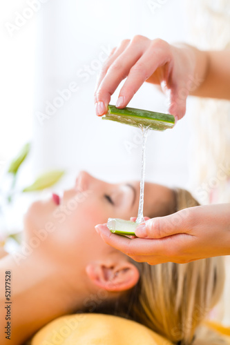Photo: Wellness - woman having aloe vera application Wellness - woman having aloe vera application