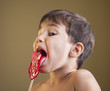 Boy Eating A Lollipop